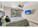 Relaxing bedroom with queen-sized bed, outdoor access, and mounted television at 1715 Greystone Blvd Blvd # 25, Mount Pleasant, SC 29464