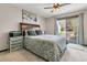 Bedroom with a comfy queen bed, storage drawers and glass doors leading to balcony at 1715 Greystone Blvd Blvd # 25, Mount Pleasant, SC 29464