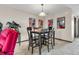 An eye-level view of the dining room with wood table, chairs and decorative wall art at 1715 Greystone Blvd Blvd # 25, Mount Pleasant, SC 29464