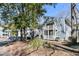 Attractive exterior view of a blue two-story condo building with white accents and decks at 1715 Greystone Blvd Blvd # 25, Mount Pleasant, SC 29464