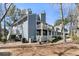 Rear exterior shot of the condo complex with balconies at 1715 Greystone Blvd Blvd # 25, Mount Pleasant, SC 29464