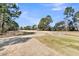 Scenic golf course view with mature trees and water features at 1715 Greystone Blvd Blvd # 25, Mount Pleasant, SC 29464