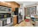 Bright eat-in kitchen with stainless steel refrigerator, oven, and a window view at 1715 Greystone Blvd Blvd # 25, Mount Pleasant, SC 29464