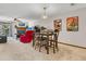 Open-plan living room, dining room area features wood-burning fireplace and access to the outdoor balcony at 1715 Greystone Blvd Blvd # 25, Mount Pleasant, SC 29464