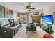 Comfortable living room with fireplace, ceiling fan and sliding door to a deck at 1715 Greystone Blvd Blvd # 25, Mount Pleasant, SC 29464