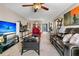 Spacious living room features a ceiling fan, brown leather seating, and a dark wood coffee table at 1715 Greystone Blvd Blvd # 25, Mount Pleasant, SC 29464