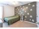 A well-lit bedroom features a bed and whimsical rainbow wall decorations at 1749 Towne St, Johns Island, SC 29455