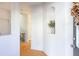 Bright entryway featuring a decorative vase in a niche, leading to an open hallway and staircase at 1749 Towne St, Johns Island, SC 29455