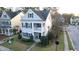 Aerial of a charming two-story home with a cozy front porch, complemented by a well-maintained yard at 1749 Towne St, Johns Island, SC 29455