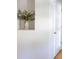 Bright hallway with a decorative vase in a wall niche, leading to a doorway at 1749 Towne St, Johns Island, SC 29455