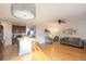 Open floor plan featuring a kitchen island that flows into a living room with light hardwood floors at 1749 Towne St, Johns Island, SC 29455