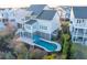 Aerial view of a luxury home featuring a backyard pool and patio in a serene neighborhood at 1962 Bellona St, Charleston, SC 29492