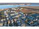 An aerial view showcases a charming coastal community near shipping facilities along the intercostal waterway at 1962 Bellona St, Charleston, SC 29492