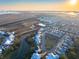 Aerial view of a neighborhood showcasing the homes' proximity to a marsh and Charleston at 1962 Bellona St, Charleston, SC 29492