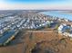 Picturesque aerial view of coastal community with marsh views, and a home with rooftop solar panels at 1962 Bellona St, Charleston, SC 29492