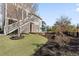 A well-manicured backyard features lush lawns, mulched beds and a lovely outdoor seating space at 1962 Bellona St, Charleston, SC 29492