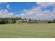 A beautiful green space and baseball field surrounded by lush trees create a picturesque place to gather at 1962 Bellona St, Charleston, SC 29492