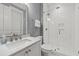 Clean bathroom featuring a glass-enclosed shower, marble countertop sink, and gray painted wall at 1962 Bellona St, Charleston, SC 29492