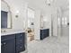 Upscale bathroom with double vanity, marble countertops, and glass-enclosed shower at 1962 Bellona St, Charleston, SC 29492