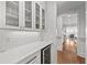 Butler's pantry features white cabinetry, quartz countertops, and a wine cooler at 1962 Bellona St, Charleston, SC 29492