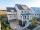 Stately home with a covered porch, three-car garage, and lush landscaping, exuding classic elegance at 1962 Bellona St, Charleston, SC 29492