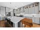 Spacious kitchen features gray cabinetry, an island with seating, and stainless steel appliances at 1962 Bellona St, Charleston, SC 29492