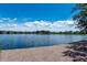 Peaceful view of lake with brick shoreline, nearby houses, and a serene sky background at 1962 Bellona St, Charleston, SC 29492
