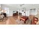 Cozy living space featuring a wet bar, beverage fridge, hardwood floors, and neutral paint at 1962 Bellona St, Charleston, SC 29492