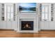 Elegant living room showcasing fireplace with built-ins and mounted television at 1962 Bellona St, Charleston, SC 29492