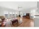 Relaxing living room with hardwood floors, comfortable sofa, access to a balcony, and media center at 1962 Bellona St, Charleston, SC 29492