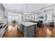 Open-concept living space includes a kitchen with an island, a living room with a fireplace, and a dining area at 1962 Bellona St, Charleston, SC 29492