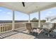 Relaxing covered porch with a chair and ottoman is perfect for enjoying the outdoors at 1962 Bellona St, Charleston, SC 29492