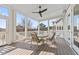 Relaxing screened porch offering a ceiling fan and a view of the outdoor scenery at 1962 Bellona St, Charleston, SC 29492