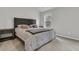 Comfortable bedroom with natural light, a queen-sized bed, and wooden furniture at 205 Cozy Brook Ct, Summerville, SC 29486