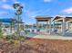 Community pool with various cabanas for relaxing and enjoying the sunny outdoors at 205 Cozy Brook Ct, Summerville, SC 29486