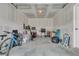 Cluttered garage featuring a bicycle, grill, storage containers, and various household items at 205 Cozy Brook Ct, Summerville, SC 29486