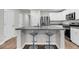 Modern kitchen featuring a spacious island with seating, stainless steel appliances, and white cabinetry at 205 Cozy Brook Ct, Summerville, SC 29486