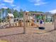 Community playground with slides, towers, and climbing features surrounded by lush greenery at 205 Cozy Brook Ct, Summerville, SC 29486