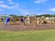 A community playground with climbing nets, slides, and other equipment for children to enjoy at 205 Cozy Brook Ct, Summerville, SC 29486