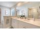 Bright bathroom featuring a double sink vanity and a glass-enclosed shower, offering a luxurious and functional space at 215 Camellia Bloom Dr, Moncks Corner, SC 29461