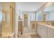 Bathroom with a walk-in shower, separate tub, vanity, and natural light at 215 Camellia Bloom Dr, Moncks Corner, SC 29461