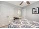 Bedroom featuring closet doors, a ceiling fan, and a doorway leading to the hallway at 215 Camellia Bloom Dr, Moncks Corner, SC 29461