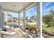 Charming front porch with rocking chairs, offering a relaxing view of the neighborhood at 215 Camellia Bloom Dr, Moncks Corner, SC 29461