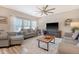 Spacious living room with comfortable seating, ceiling fan, and ample natural light at 215 Camellia Bloom Dr, Moncks Corner, SC 29461