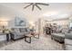Open-concept living room with seamless flow to the dining area and kitchen at 215 Camellia Bloom Dr, Moncks Corner, SC 29461