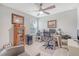 Bright and airy office space with large desk, display cabinet, and comfortable chair at 215 Camellia Bloom Dr, Moncks Corner, SC 29461