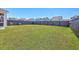 Expansive, well-manicured backyard enclosed by a dark fence, providing a private and spacious outdoor area at 215 Shortmarsh St, Summerville, SC 29486