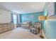 A baby's room with a gray crib, dresser, recliner, and starry decor at 215 Shortmarsh St, Summerville, SC 29486