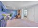 Bonus room featuring a TV, desk, seating, and view into an adjacent bedroom at 215 Shortmarsh St, Summerville, SC 29486