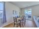 Dining room with a dark wood table, seating for six, and sliding glass doors to an outdoor patio at 215 Shortmarsh St, Summerville, SC 29486